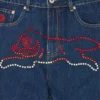 Pantaloni in denim con Running Dog che corre in cristalli