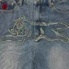 Pantaloni in denim da donna effetto consumato con Running Dog